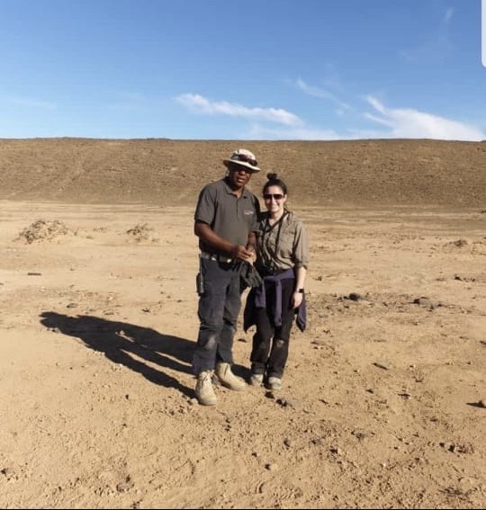 Project Executive Melanie Villegas in the desert while on an international project visit