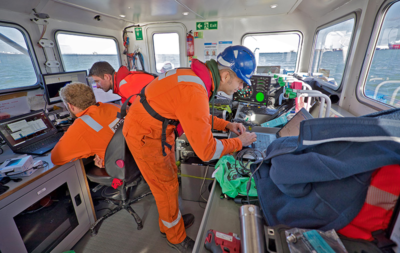 Safelane team working at sea from the bridge of a ship