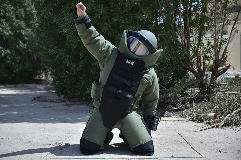 A safelane expert in a bomb disposal suit